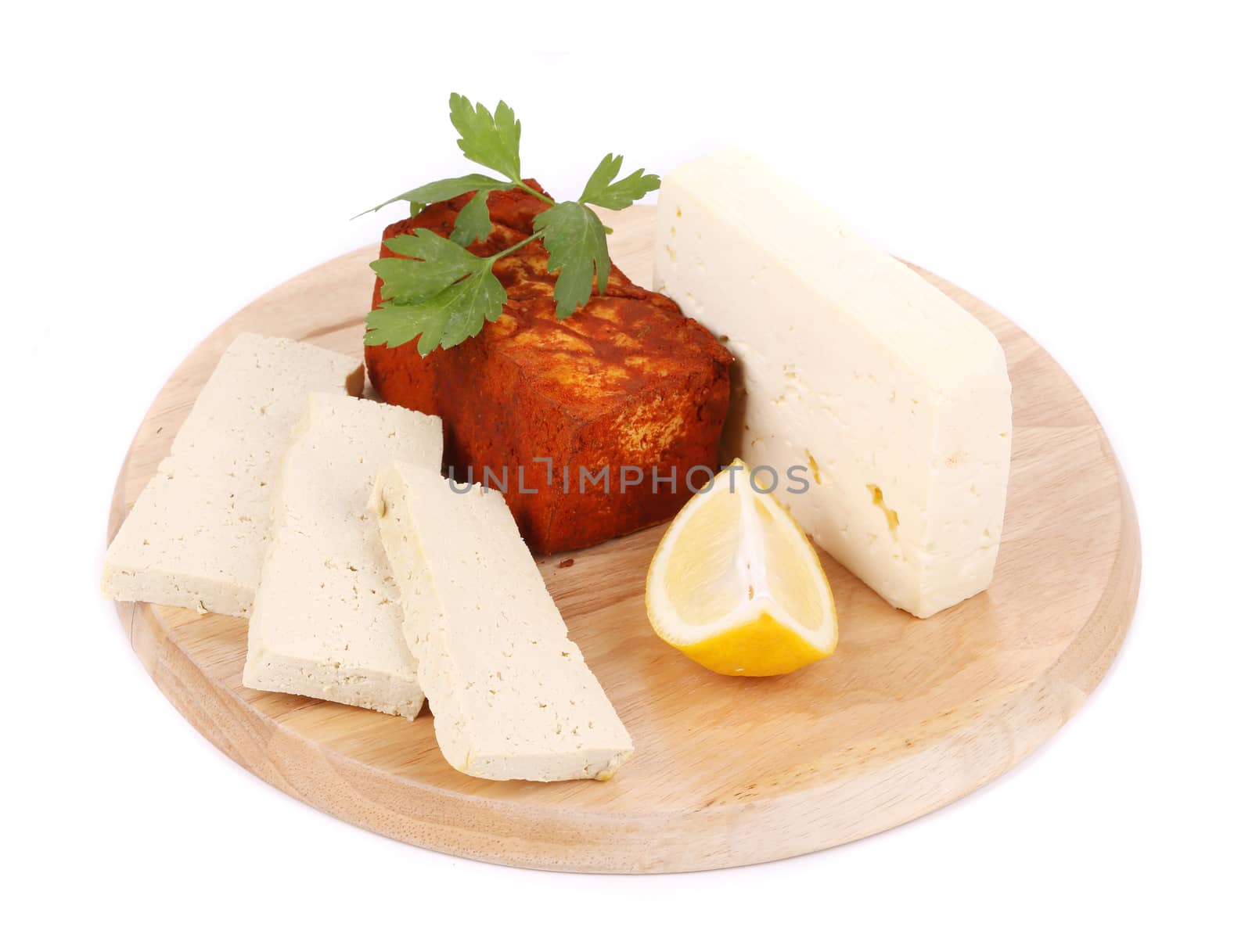 Tofu on a wooden table. Isolated on a white background.