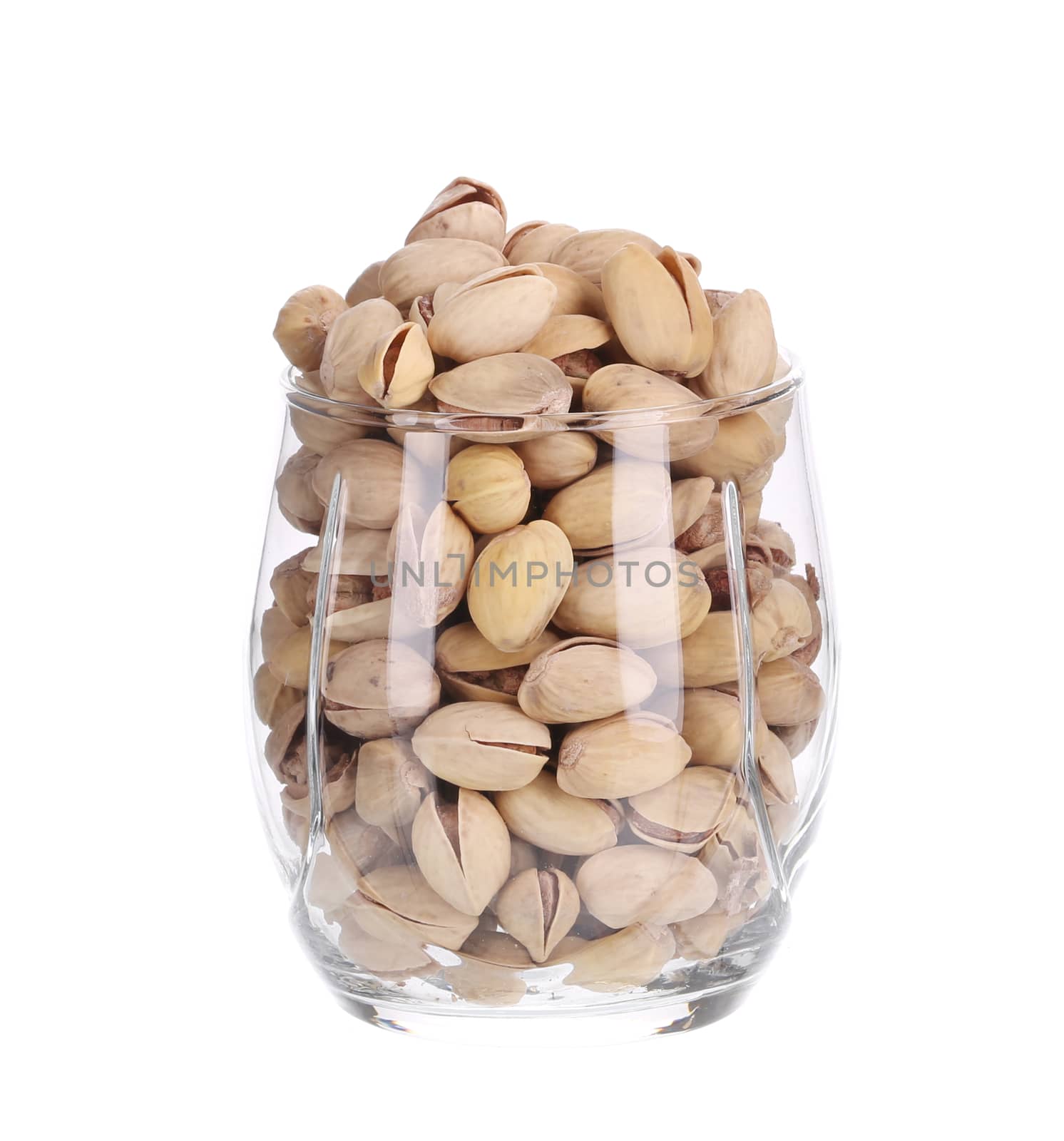 Glass with pistachios. Isolated on a white background.