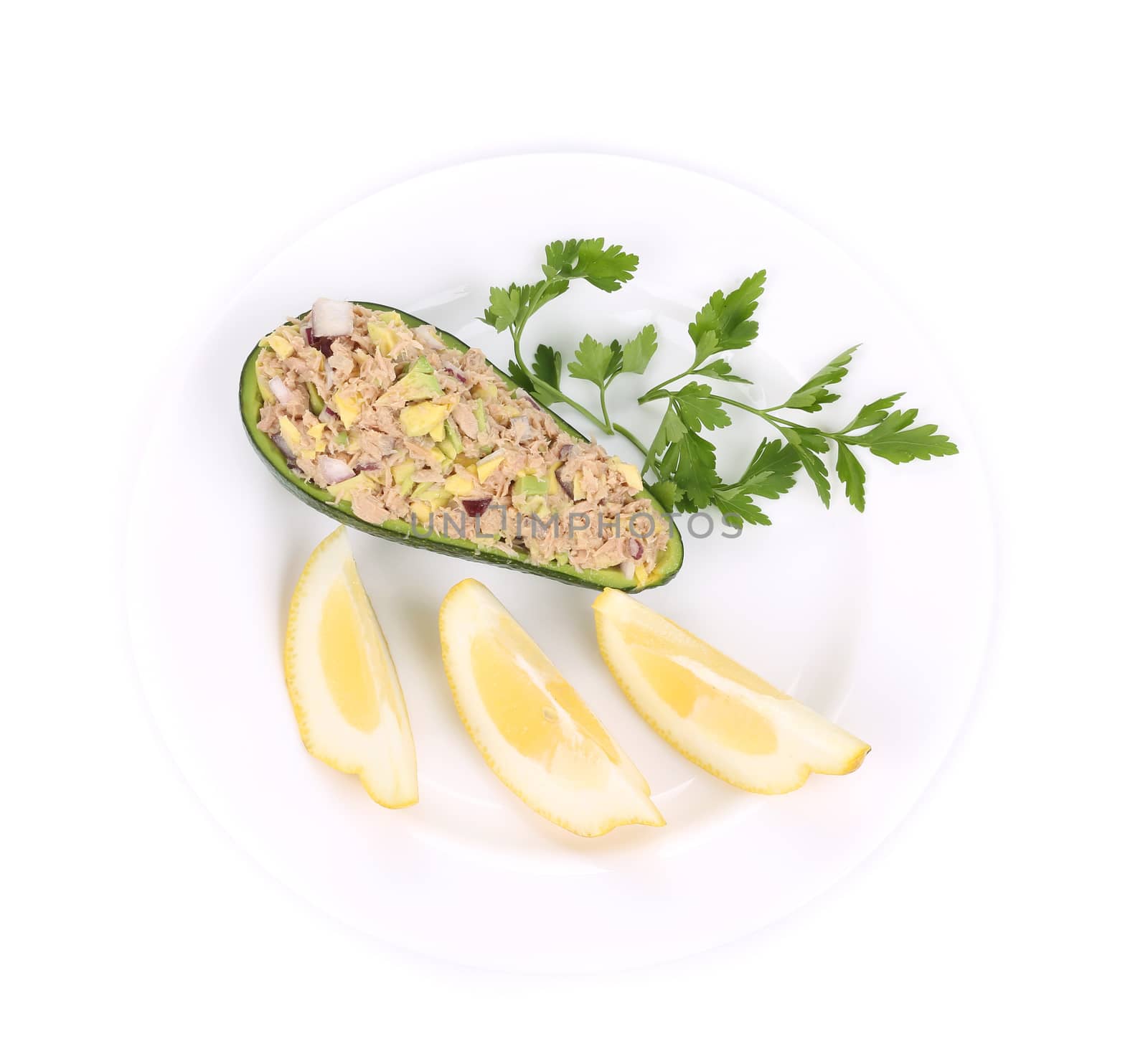 Avocado salad with tuna. Isolated on a white background.