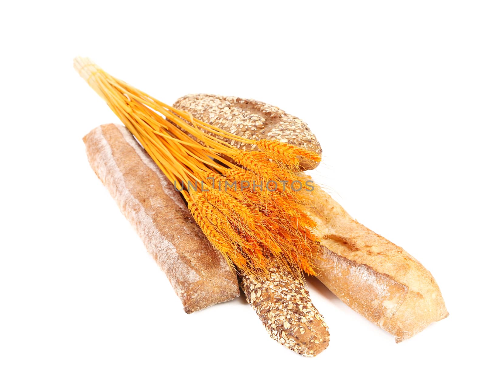 Fresh bread and wheat ears. Isolated on a white background.