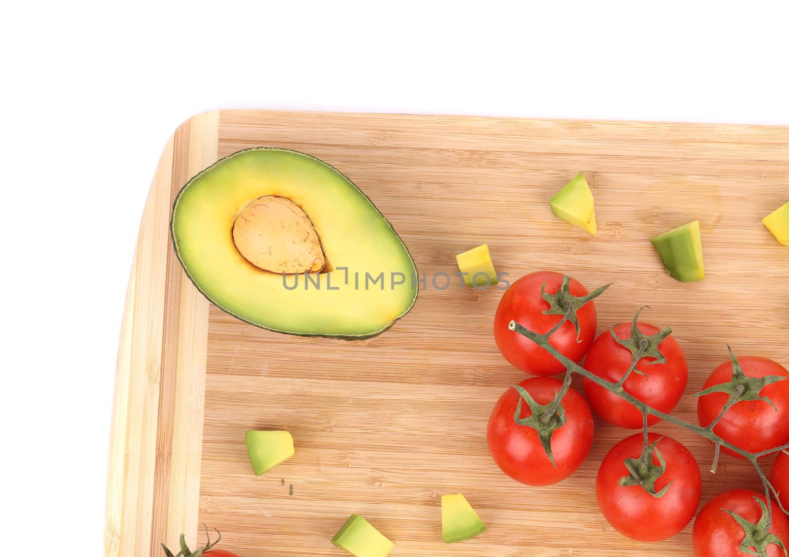 Fresh vegetables on cutting board. Isolated on a white background.