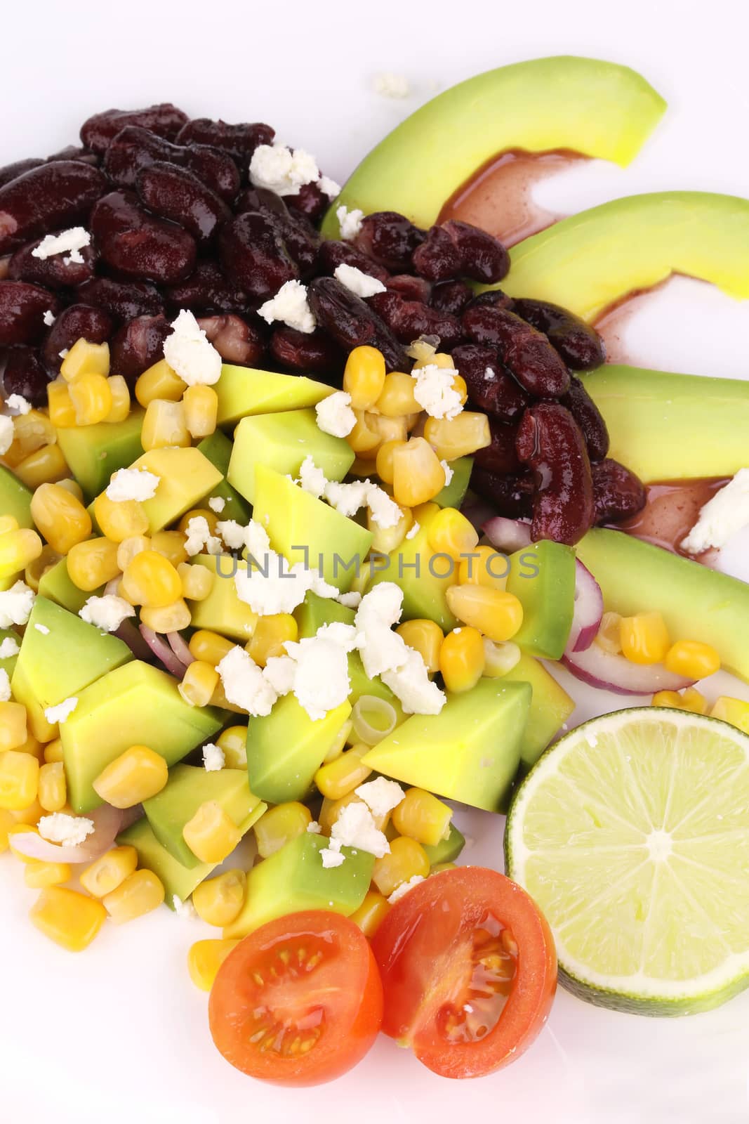 Red beans salad with avocado. Isolated on a white background.