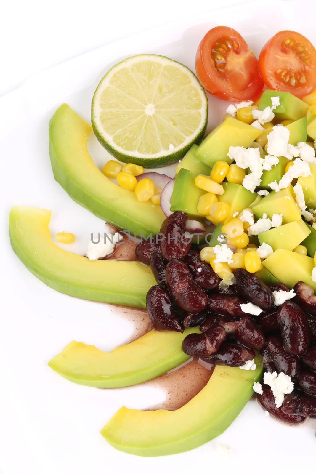 Red beans salad with avocado. Isolated on a white background.
