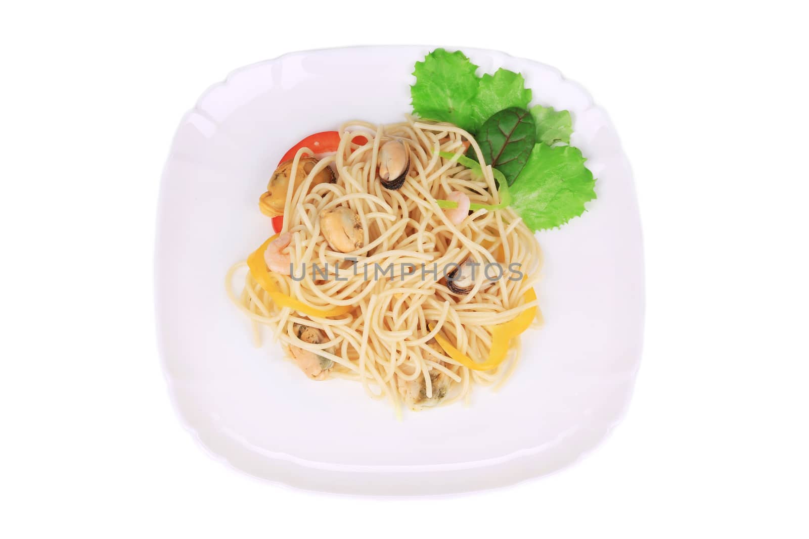 Seafood salad with spaghetti. Isolated on a white background.