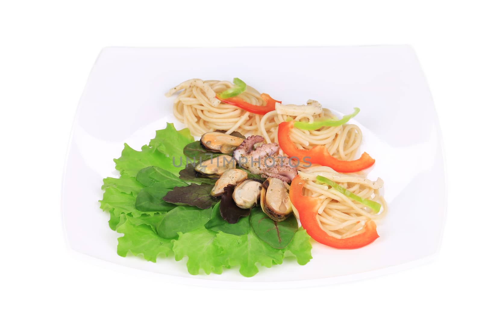 Seafood salad with spaghetti. Isolated on a white background.