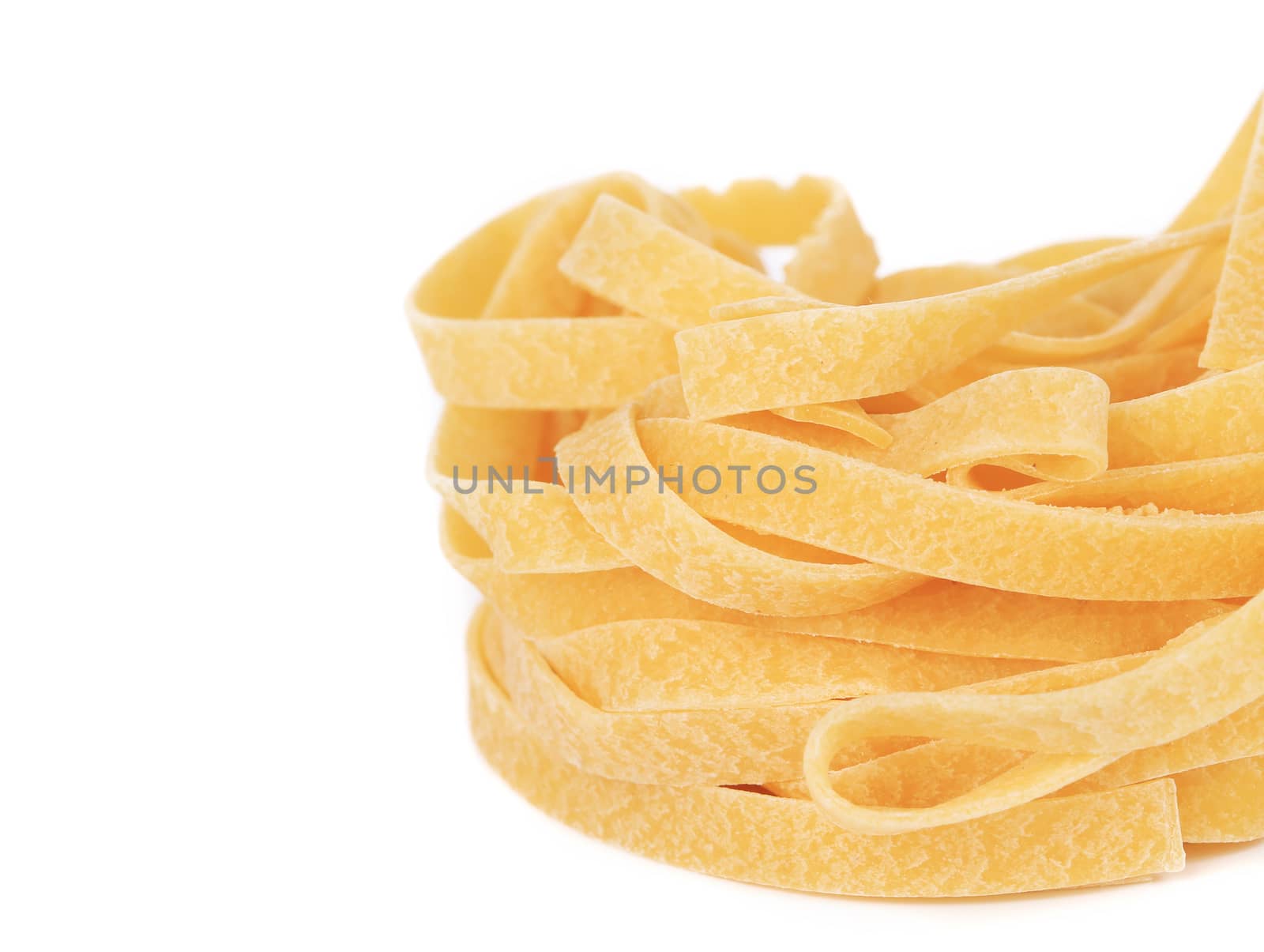 Tagliatelle italian pasta. Isolated on a white background.