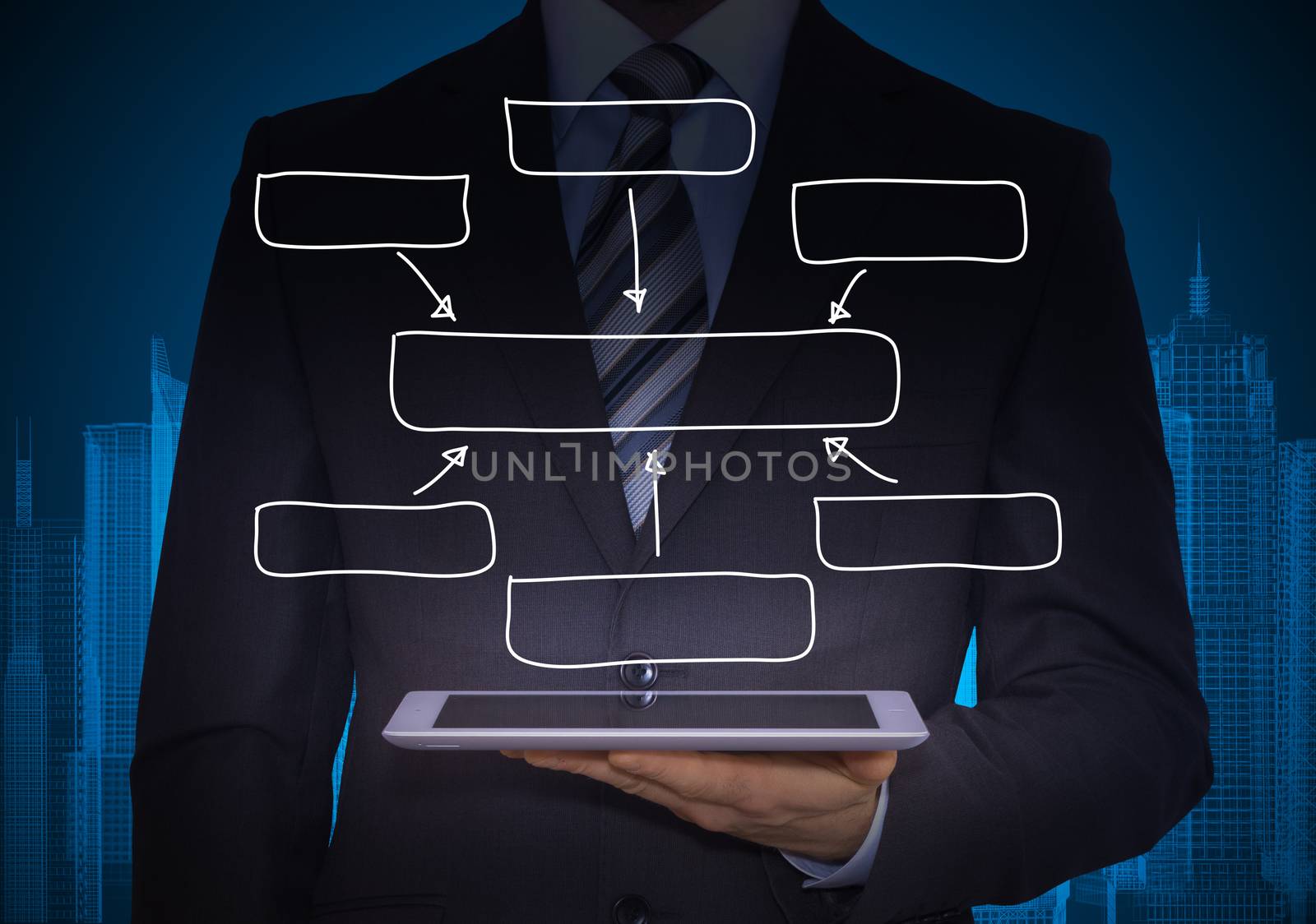 Man in suit holding tablet pc. Above the screen of the tablet are block diagram