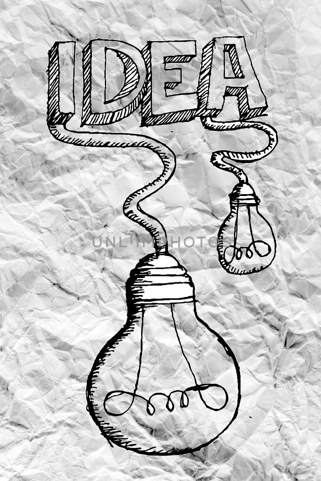 idea concept light bulb on crumpled paper by kiddaikiddee
