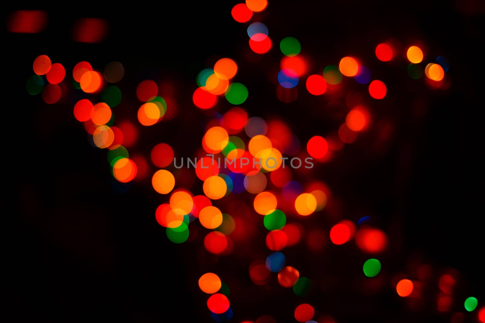 Colorful holiday abstract background in defocus photographed closeup