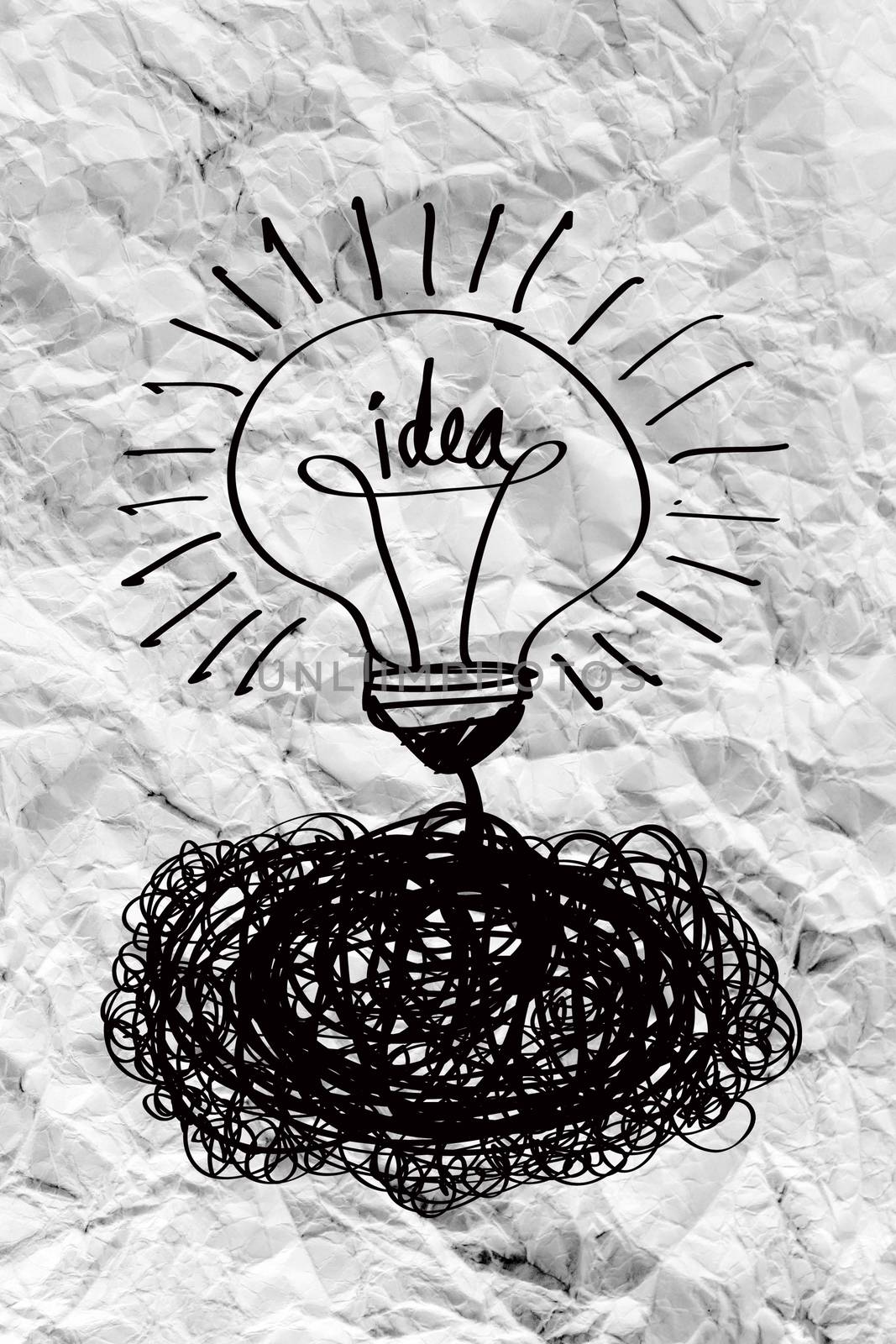 idea concept light bulb on crumpled paper by kiddaikiddee