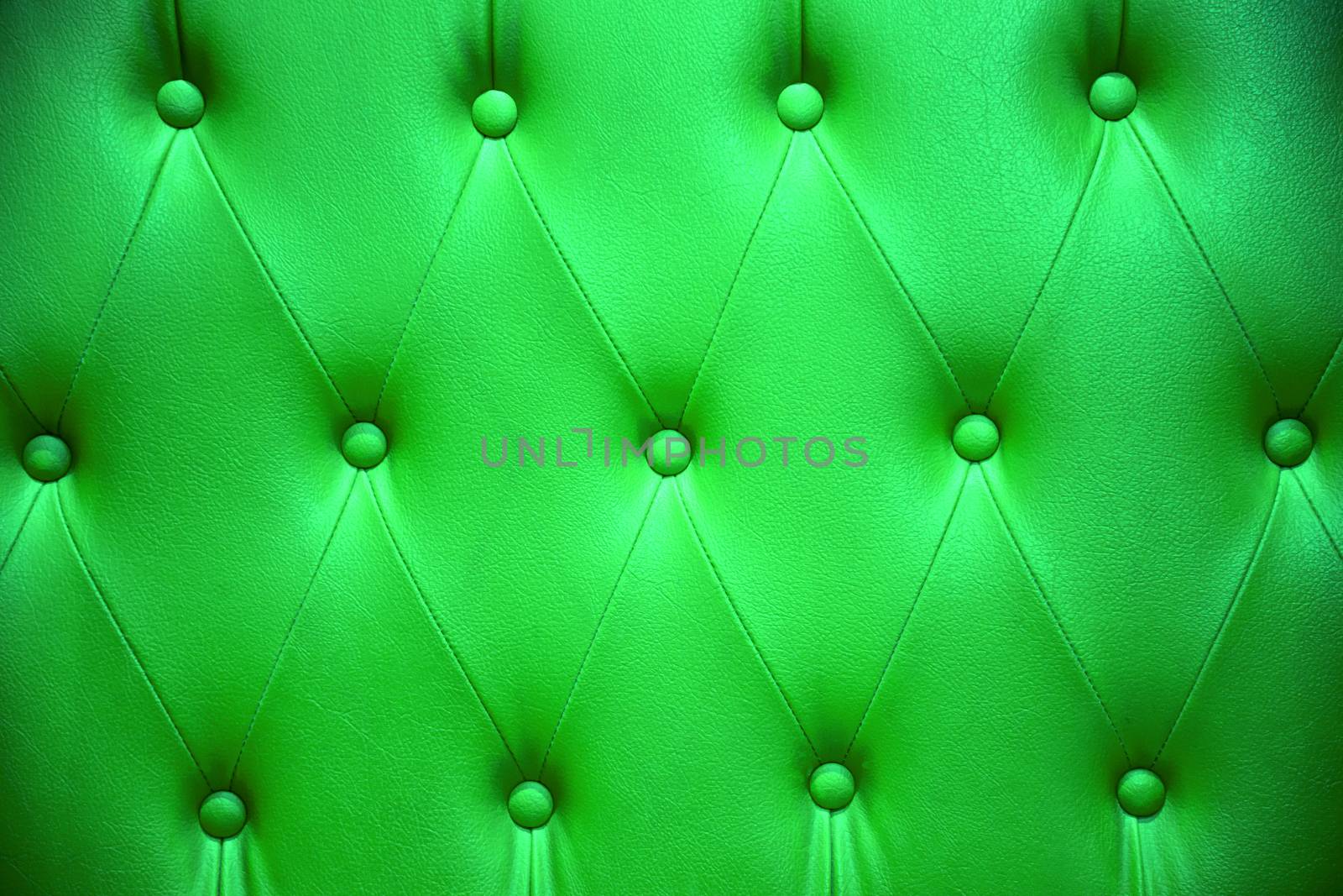 Emerald green color of upholstery leather pattern as background by jakgree