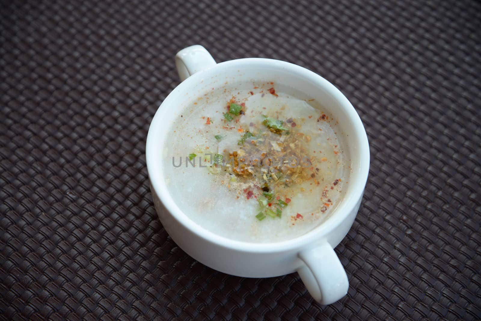 Traditional thai porridge rice gruel in bowl, con gee