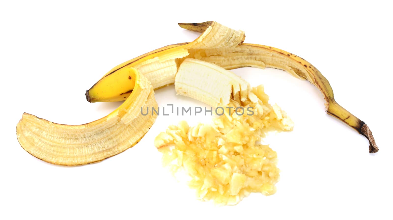 Peeled overripe banana, whole and mashed, isolated on a white background