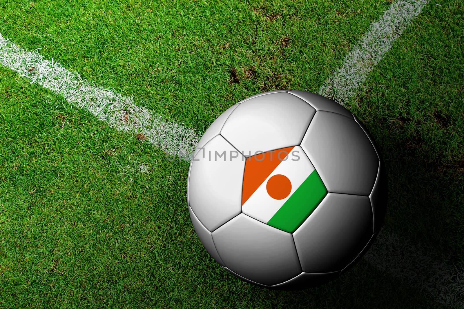 Niger Flag Pattern of a soccer ball in green grass by jakgree