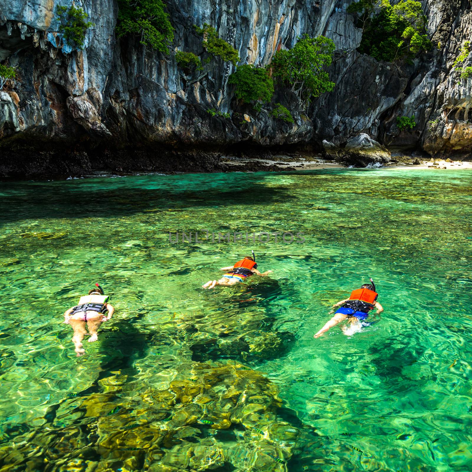 Family snorkeling on the Gulf of Thai , Thailand.