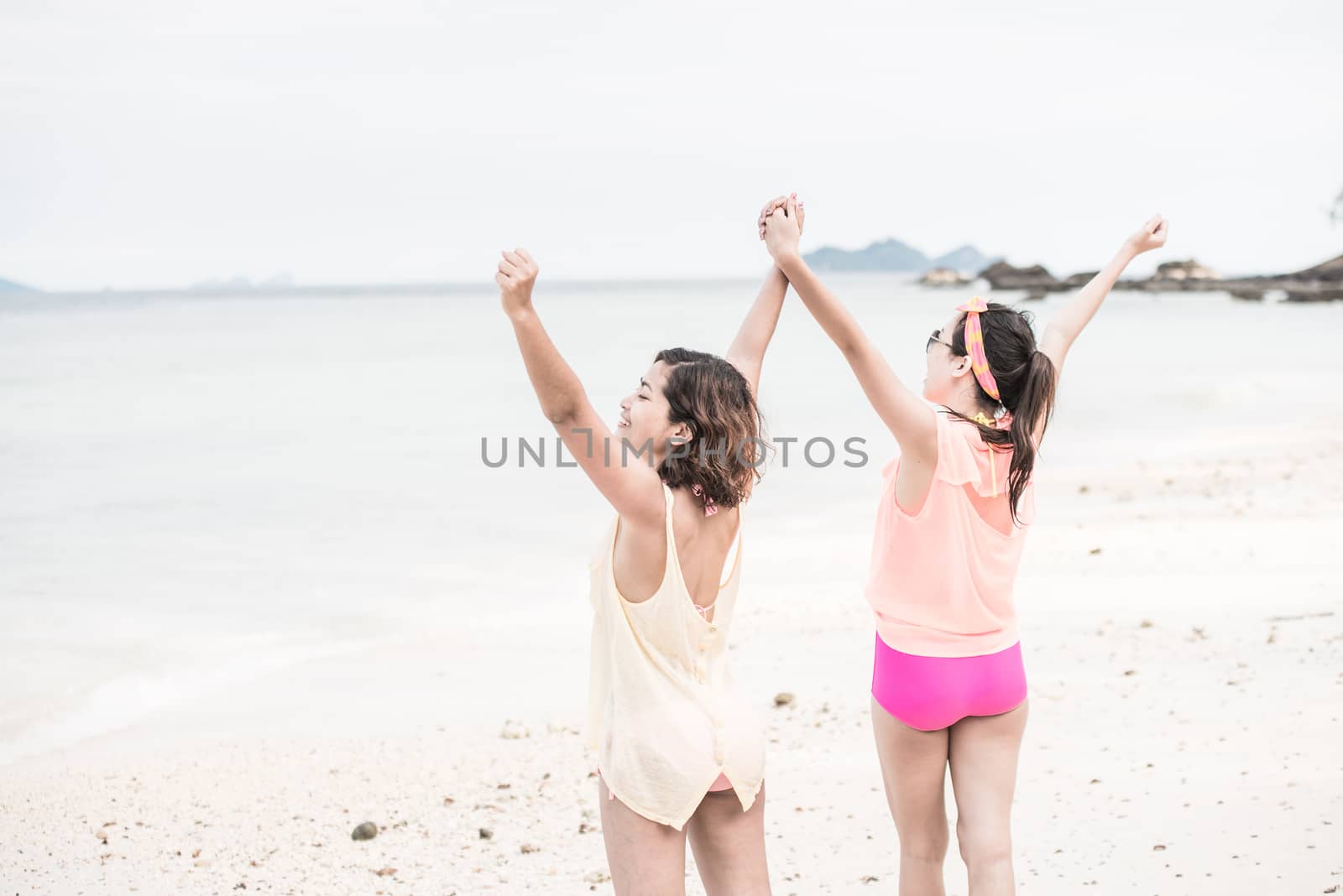 woman hang out together sand by sea 