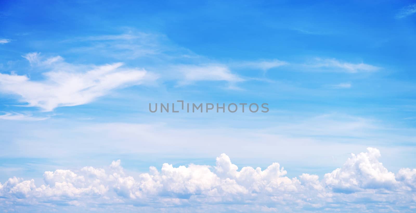 blue sky background with tiny clouds by jakgree