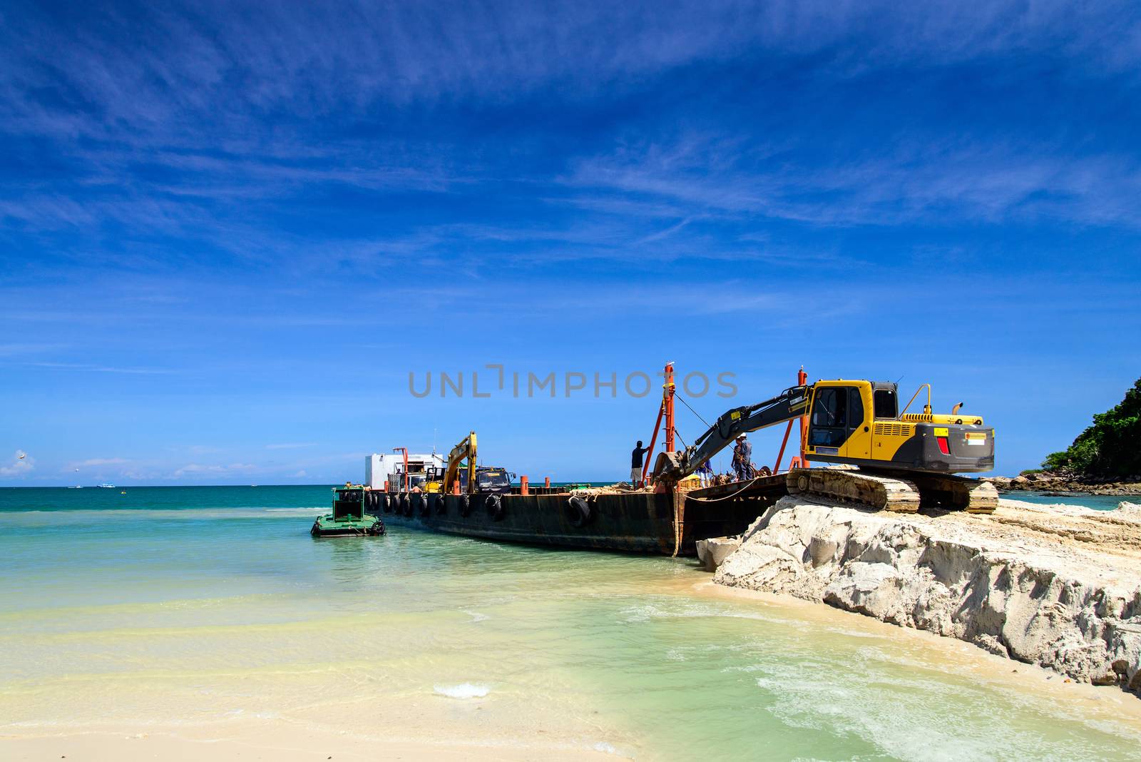 bulldozer working on a beach