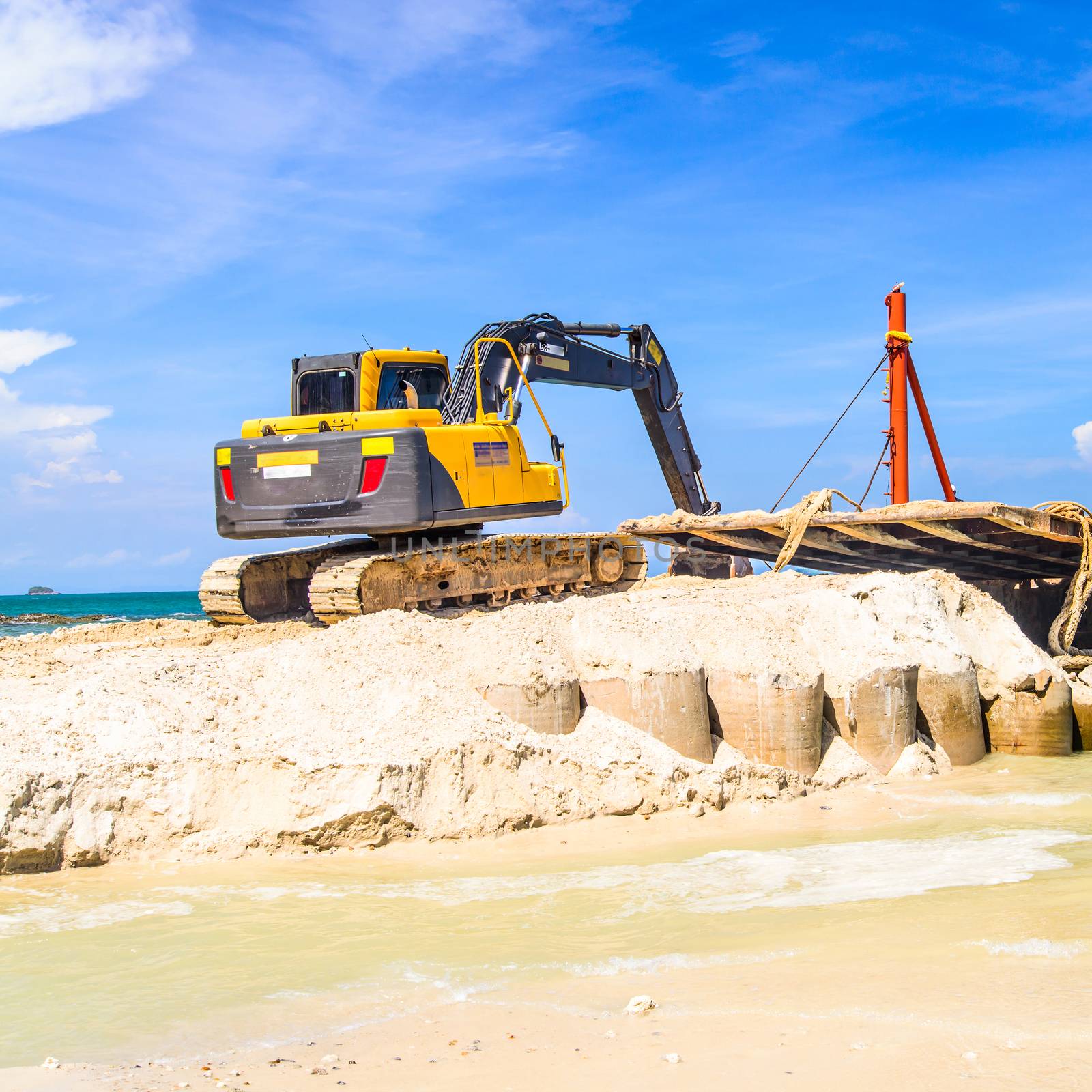 bulldozer working on a beach 