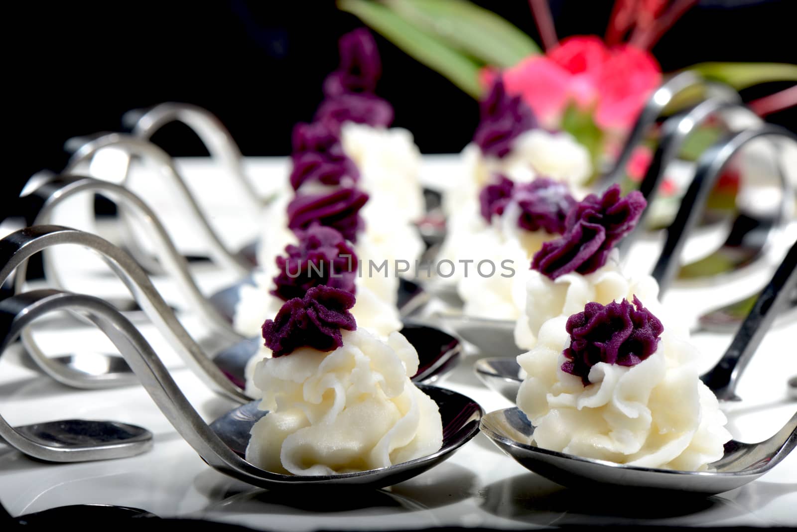 Chinese Food:Dessert made of Purple sweet potato and yam on a black background