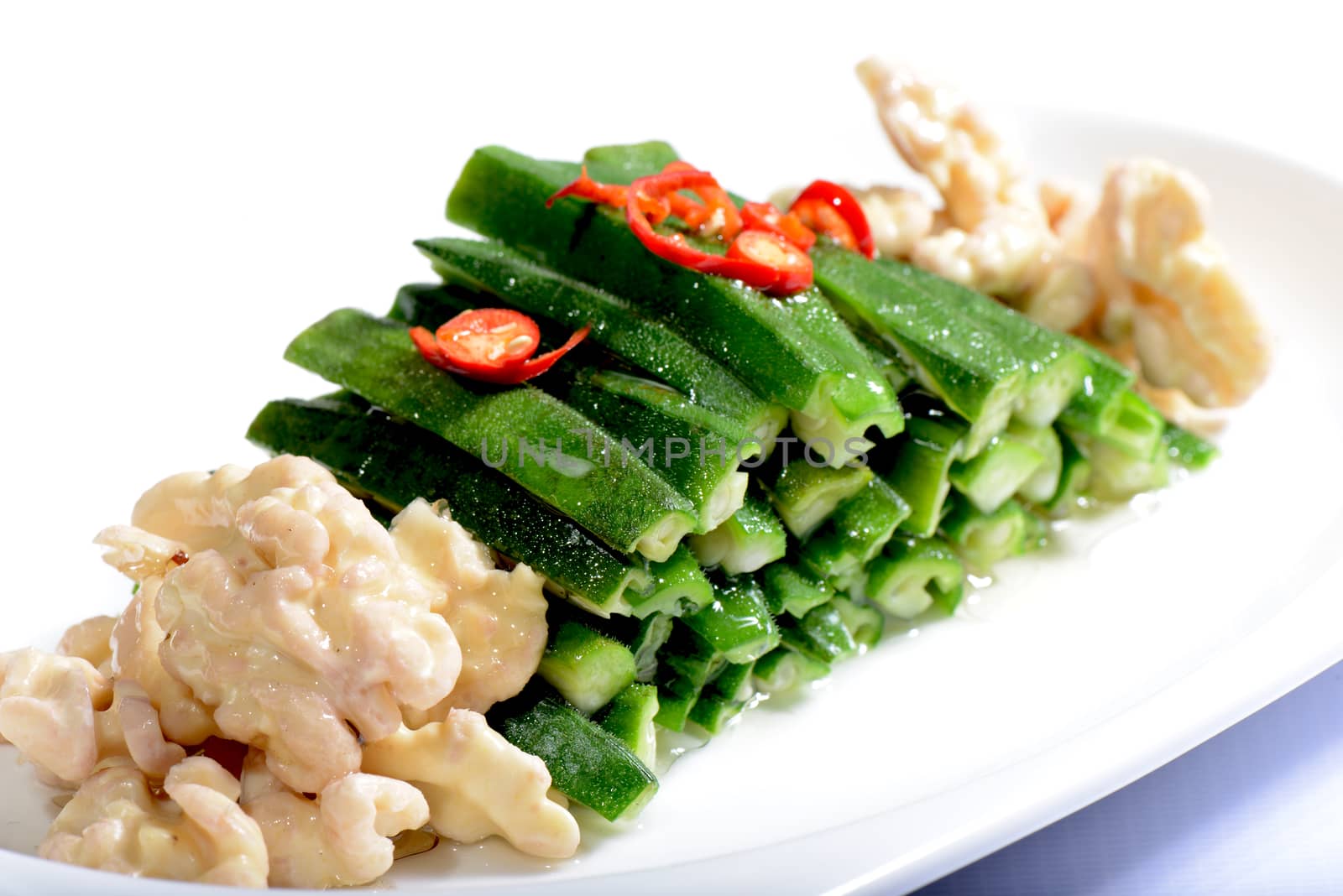 Chinese Food:Salad made of walnut kernel and vegetable on a white plate