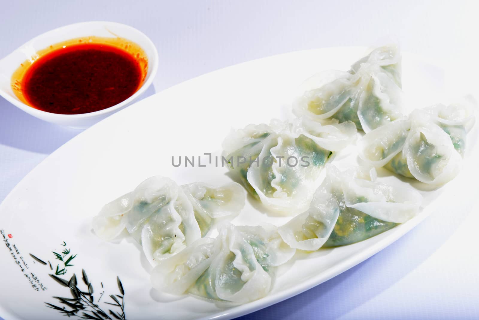 Chinese Food: Colorful steamed dumplings with sauce