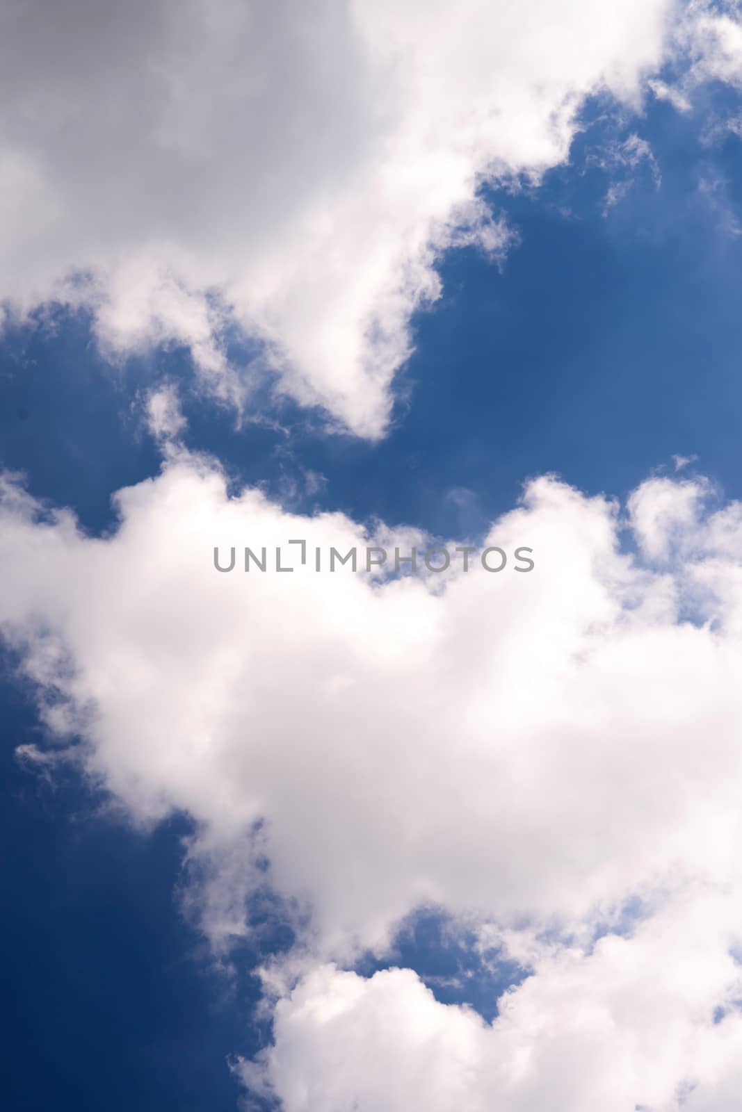 blue sky background with tiny clouds by jakgree