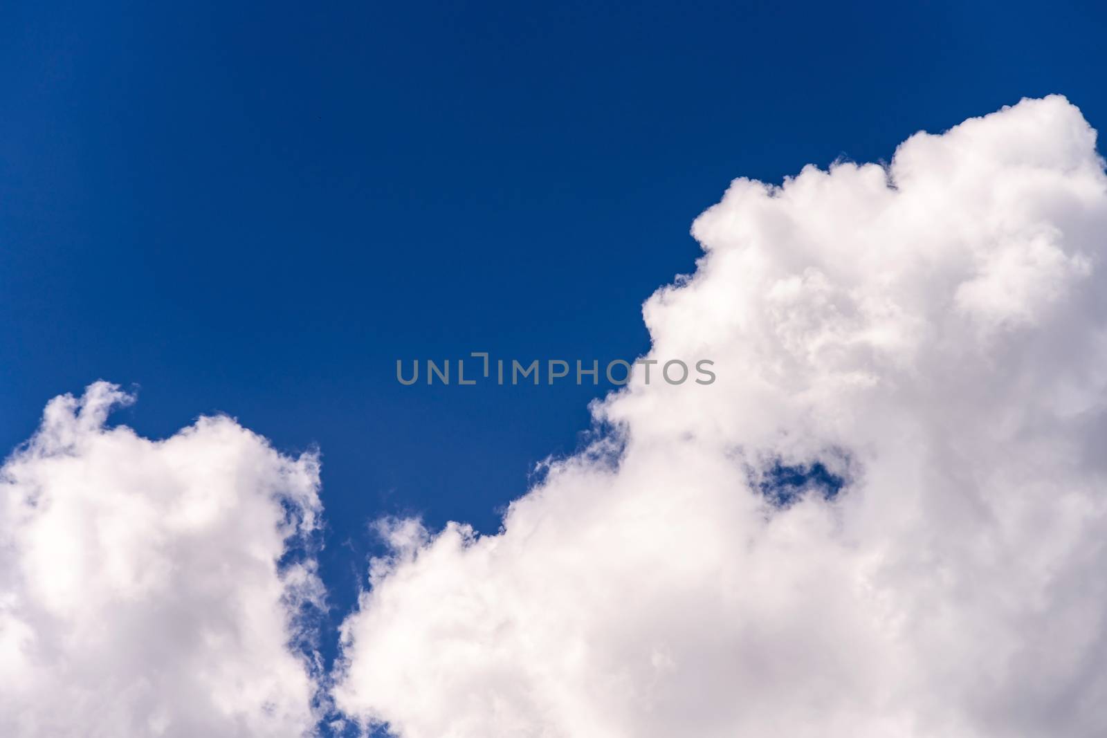 blue sky background with tiny clouds by jakgree