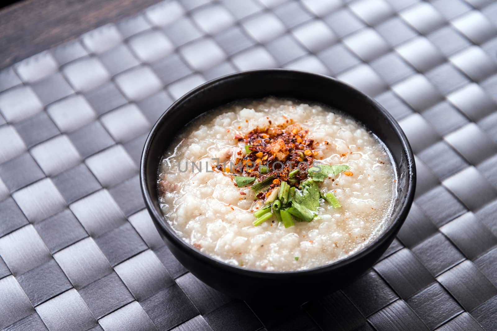 Traditional thai porridge rice gruel in bowl, con gee by jakgree