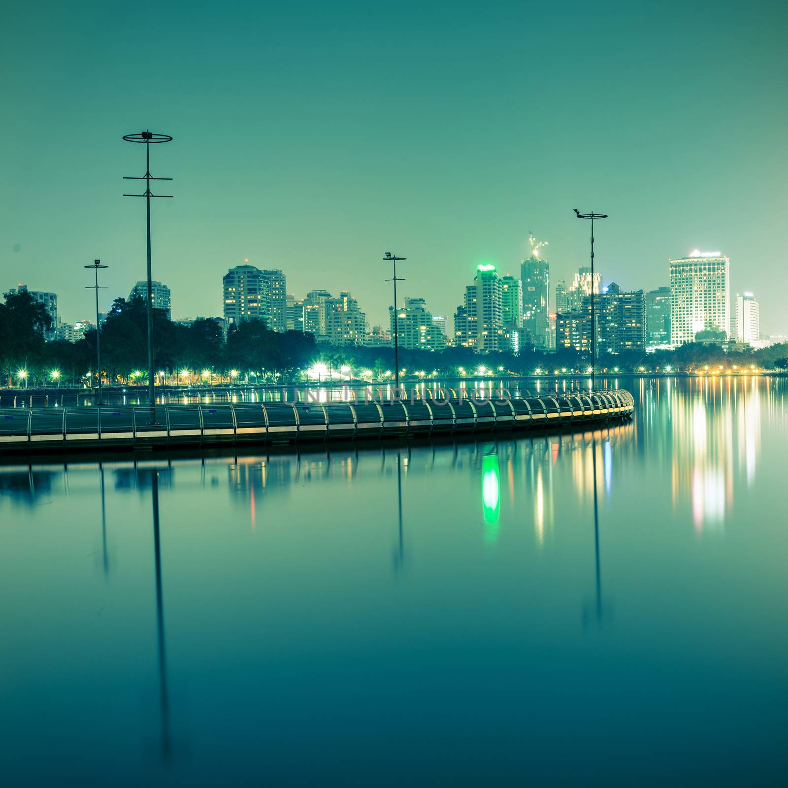 City at night with reflection of skyline,Vintage tone by jakgree