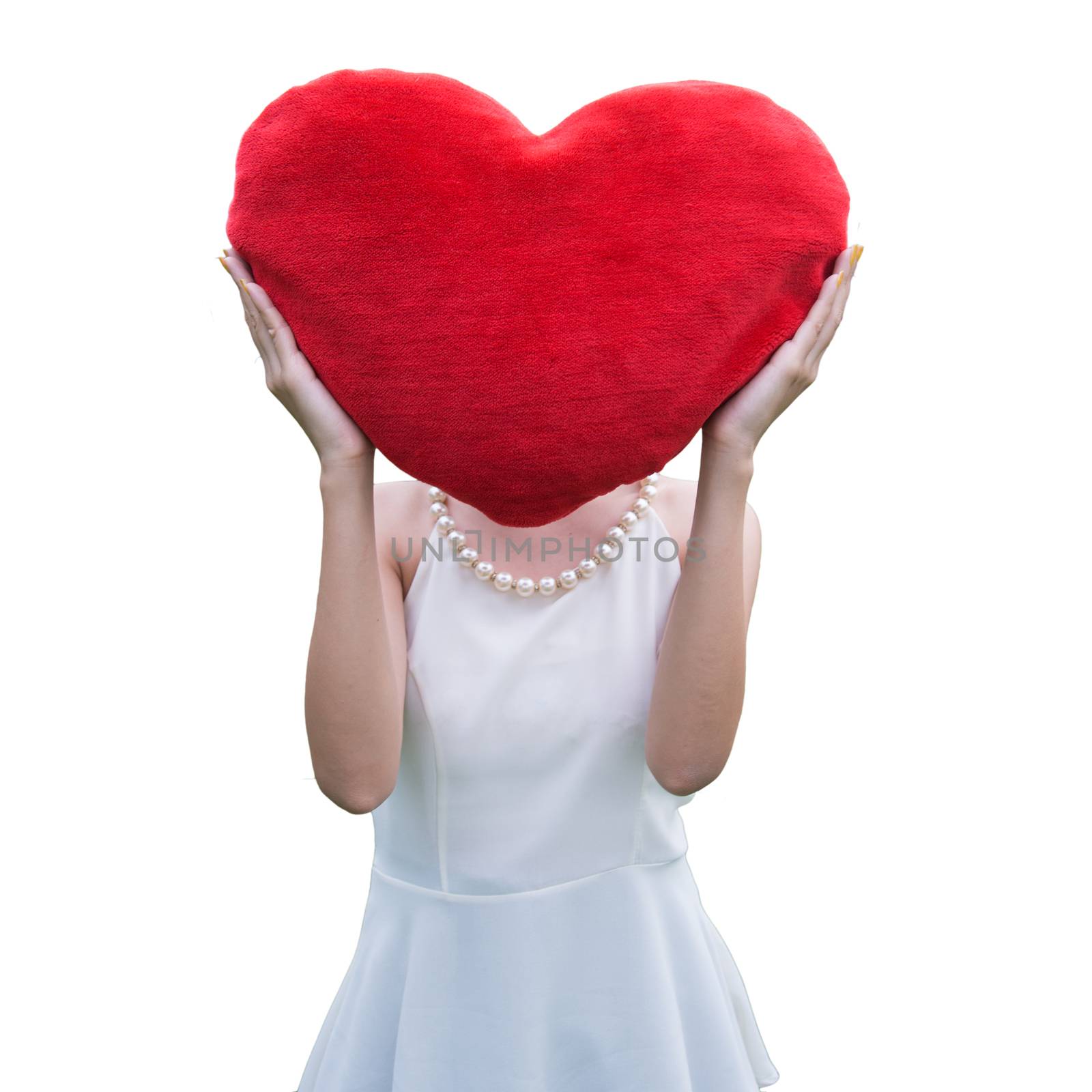 Women holding big love heart shape pillow isolated on white back by jakgree