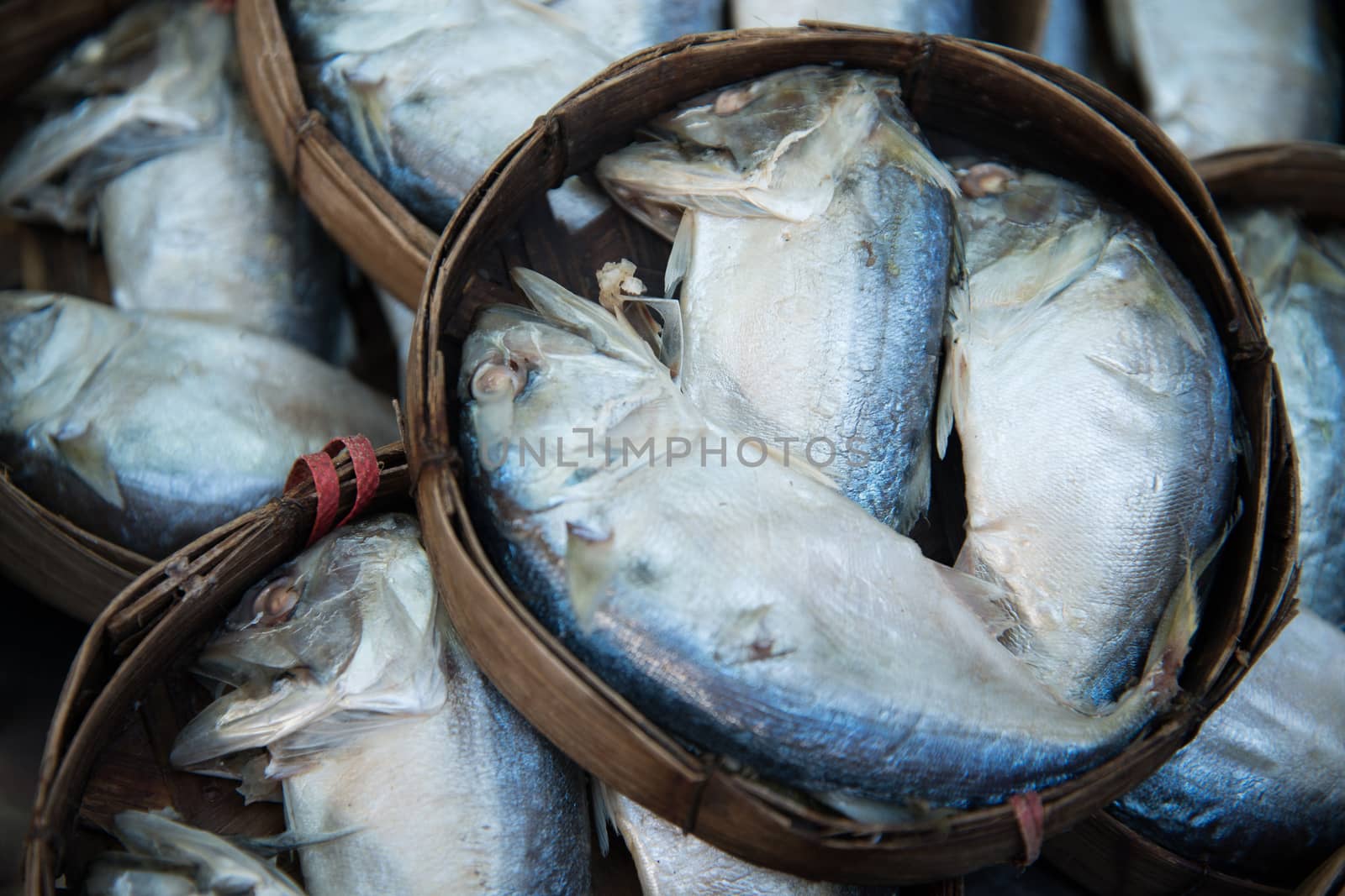 Mackerel fish in bamboo basket at market, Thailand by jakgree