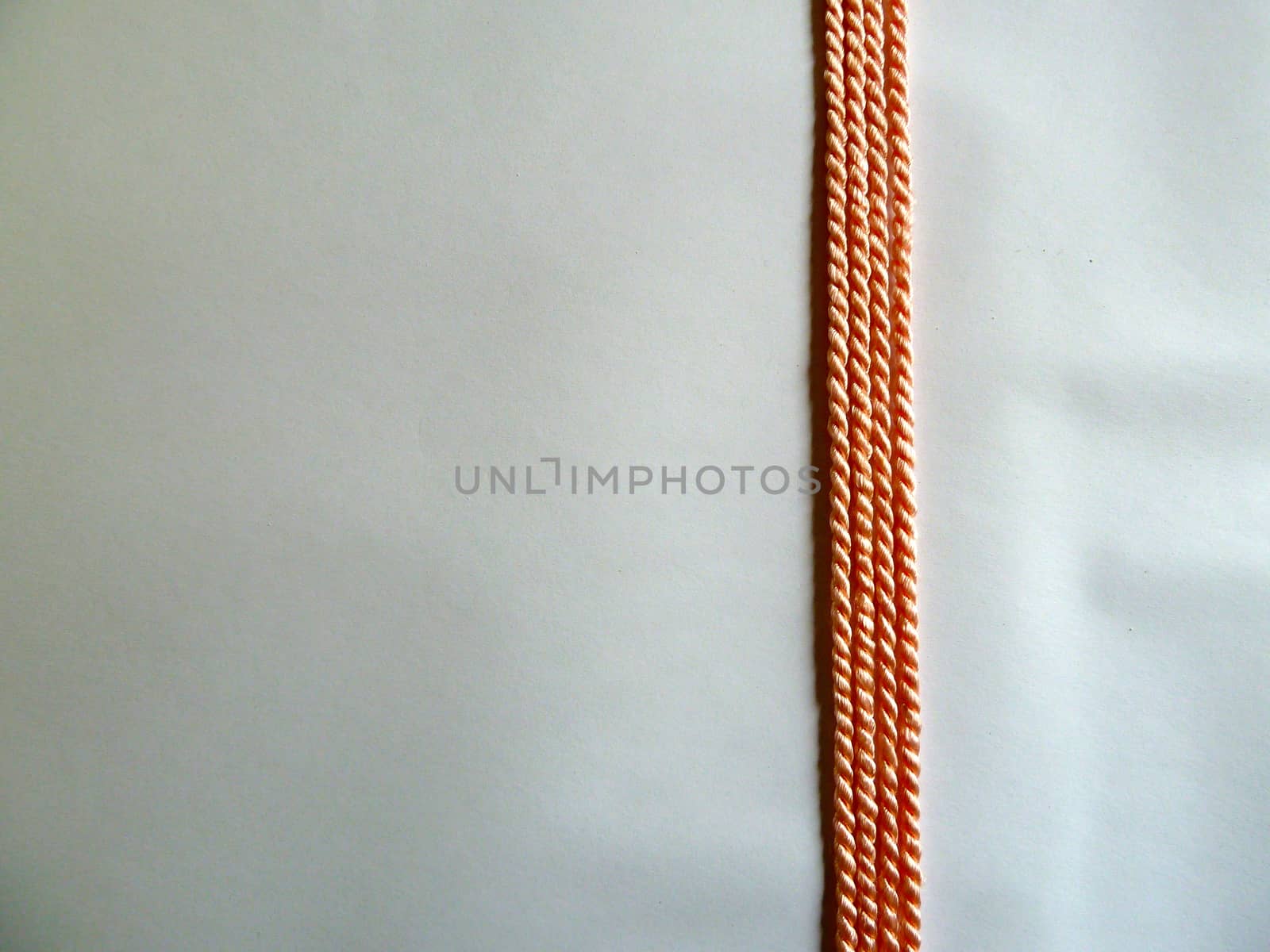 Thin bright orange ropes in a straight line
