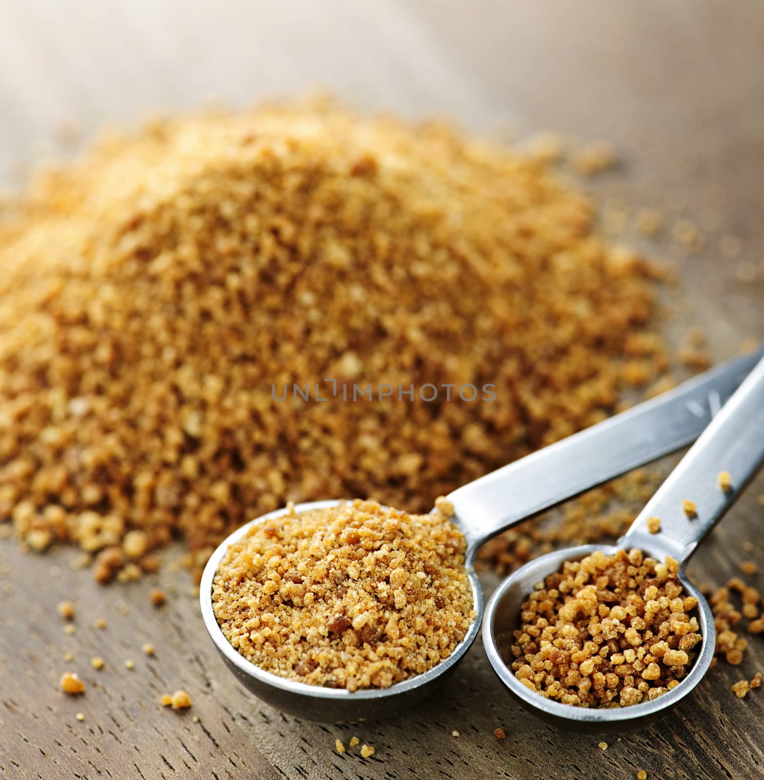 Organic coconut palm sugar in measuring spoons