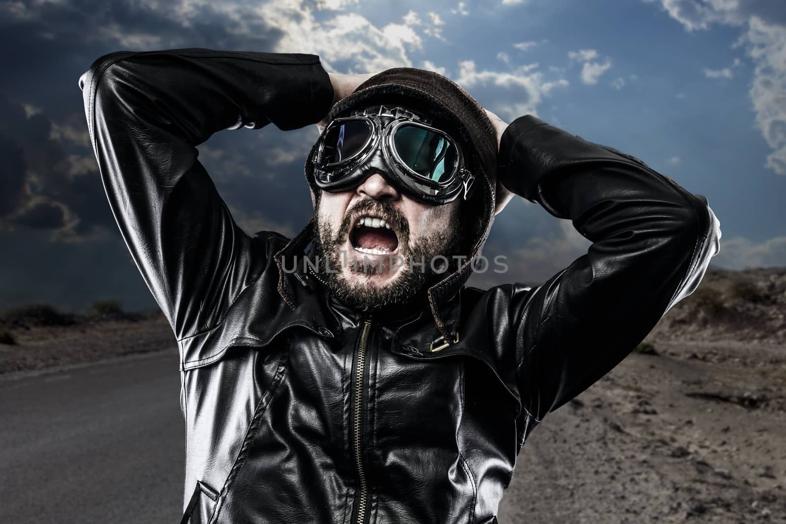 surprised biker with black leather jacket and old glasses by FernandoCortes