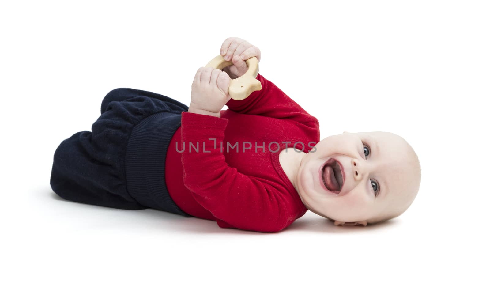 laughing baby in red shirt on floor. isolated on white background