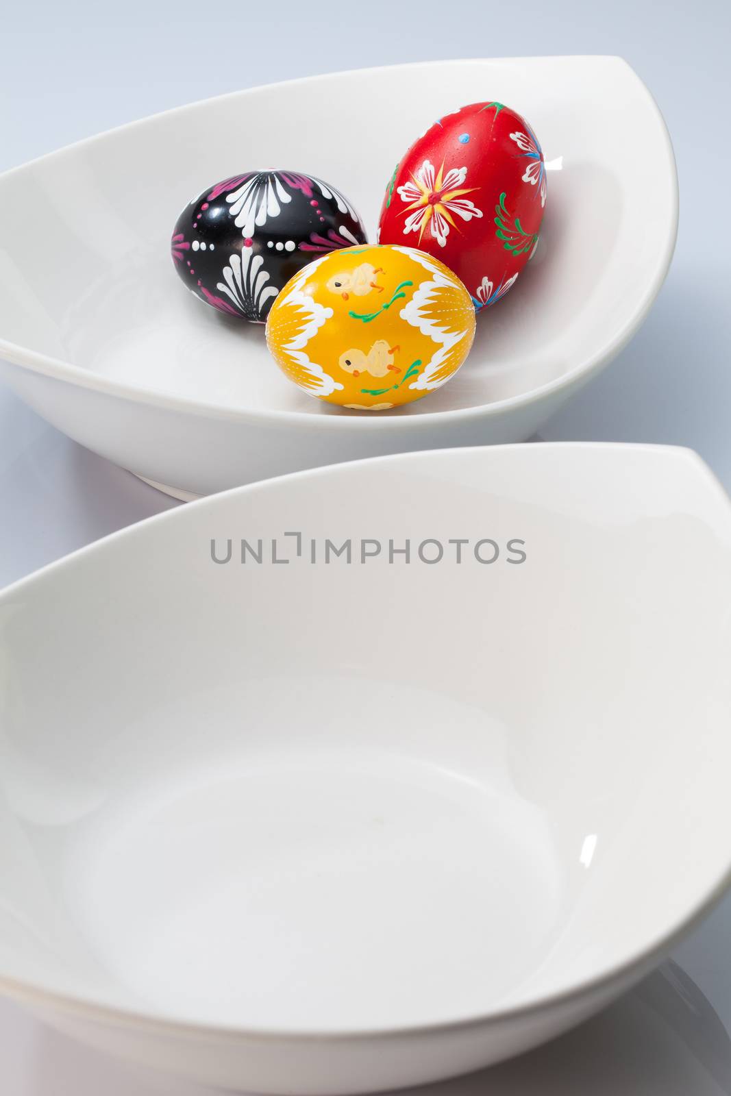 Two white bowls and easter eggs by CaptureLight