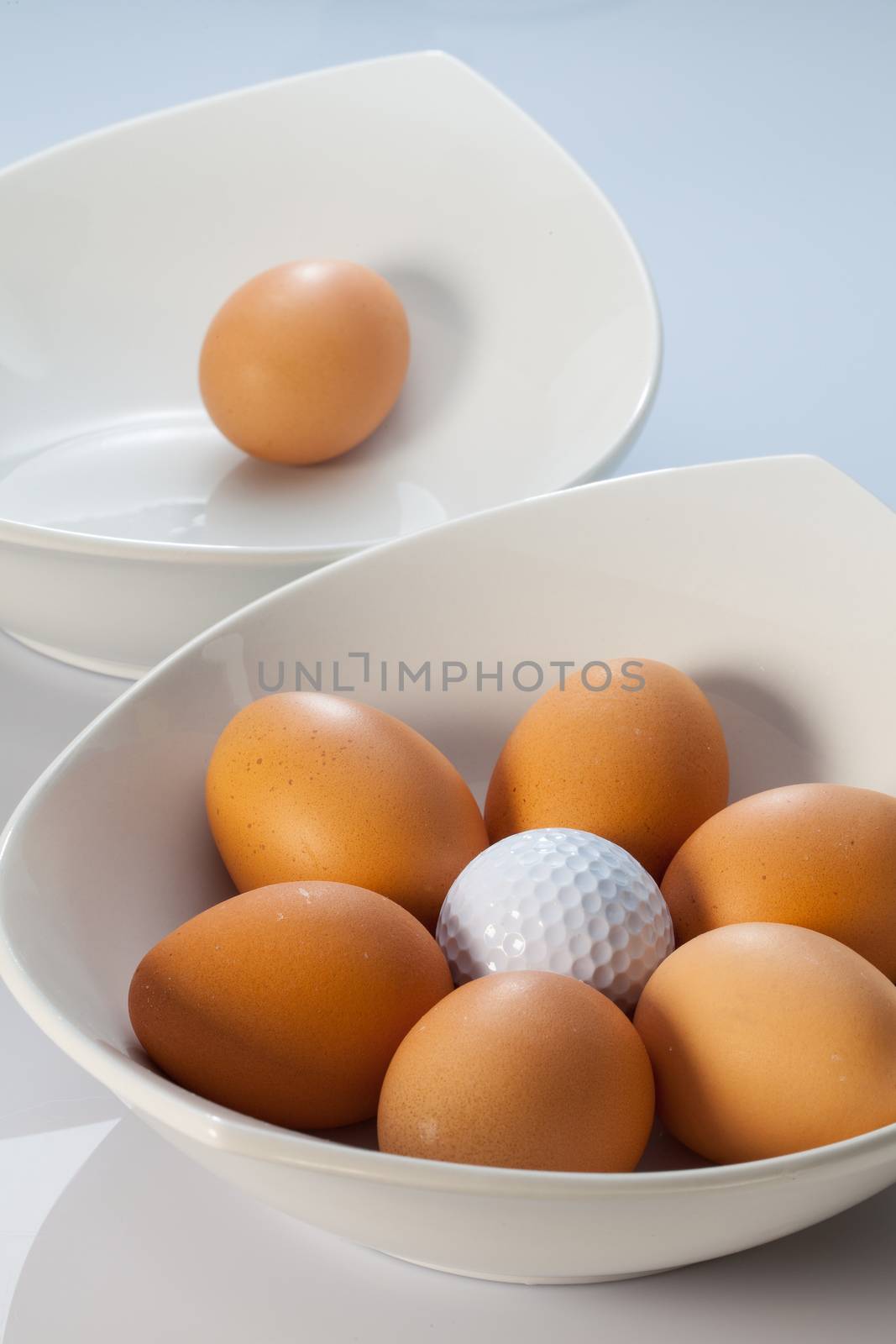 White bowls, easter eggs and golf balls by CaptureLight