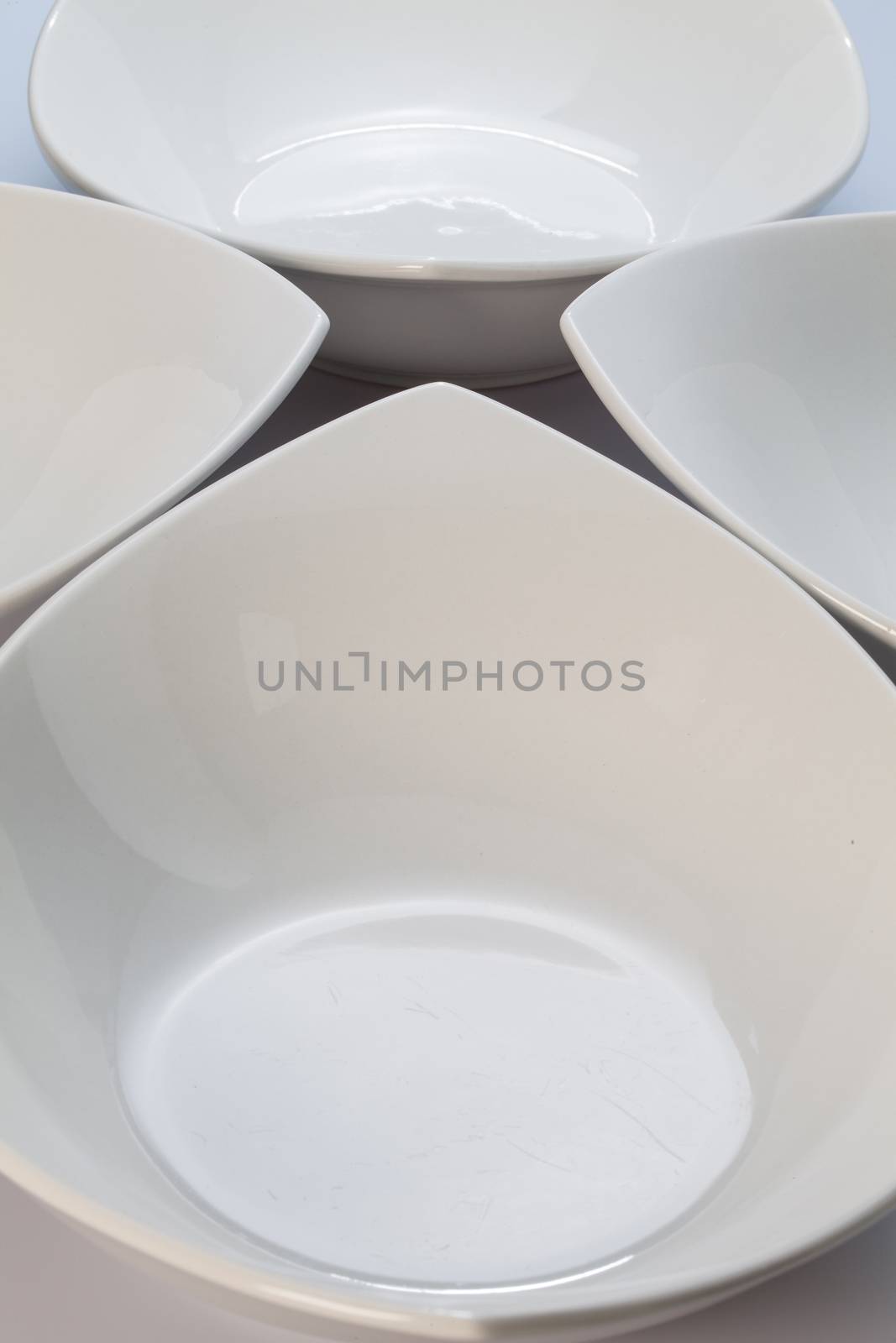 Four White ceramics bowls by CaptureLight