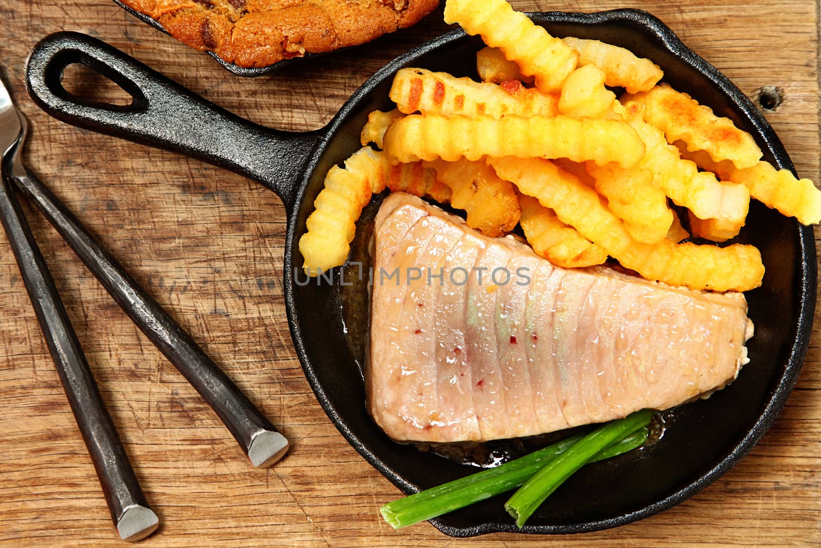 Sashimi Tuna and Chips in Skillet on Table at home or restaurant.