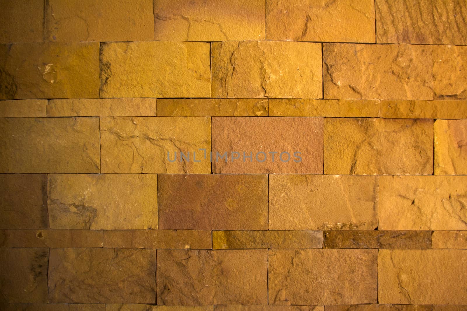 Yellow rough stone texture wall horizontal background