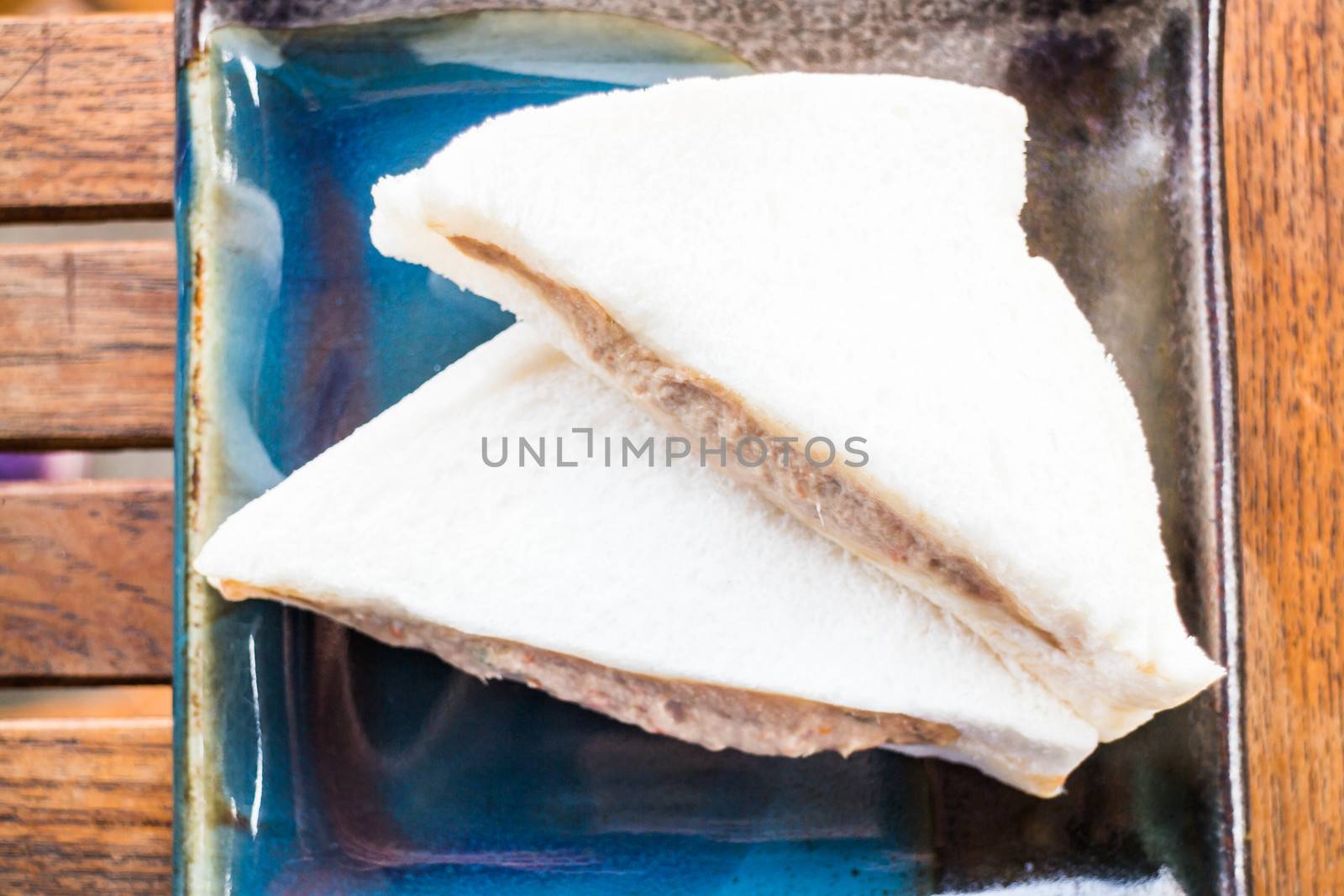 Tuna sandwiches on the plate up close  by punsayaporn