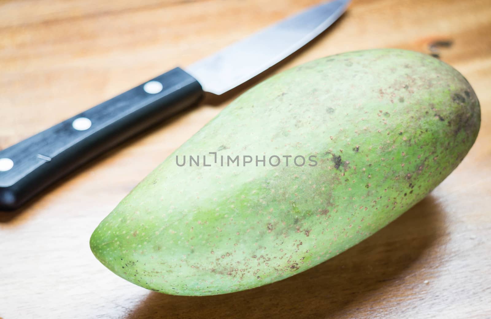 Green mango prepare for peeling, stock photo