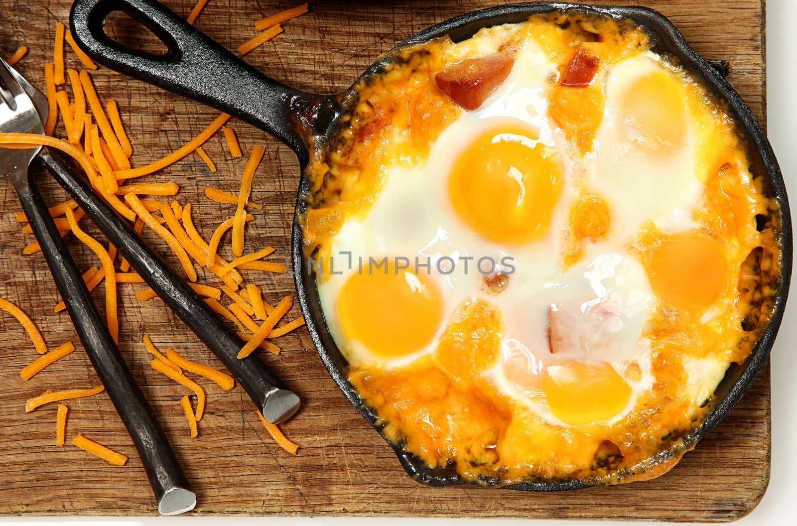 Skillet Baked Eggs and Sausage with Cheese on Table