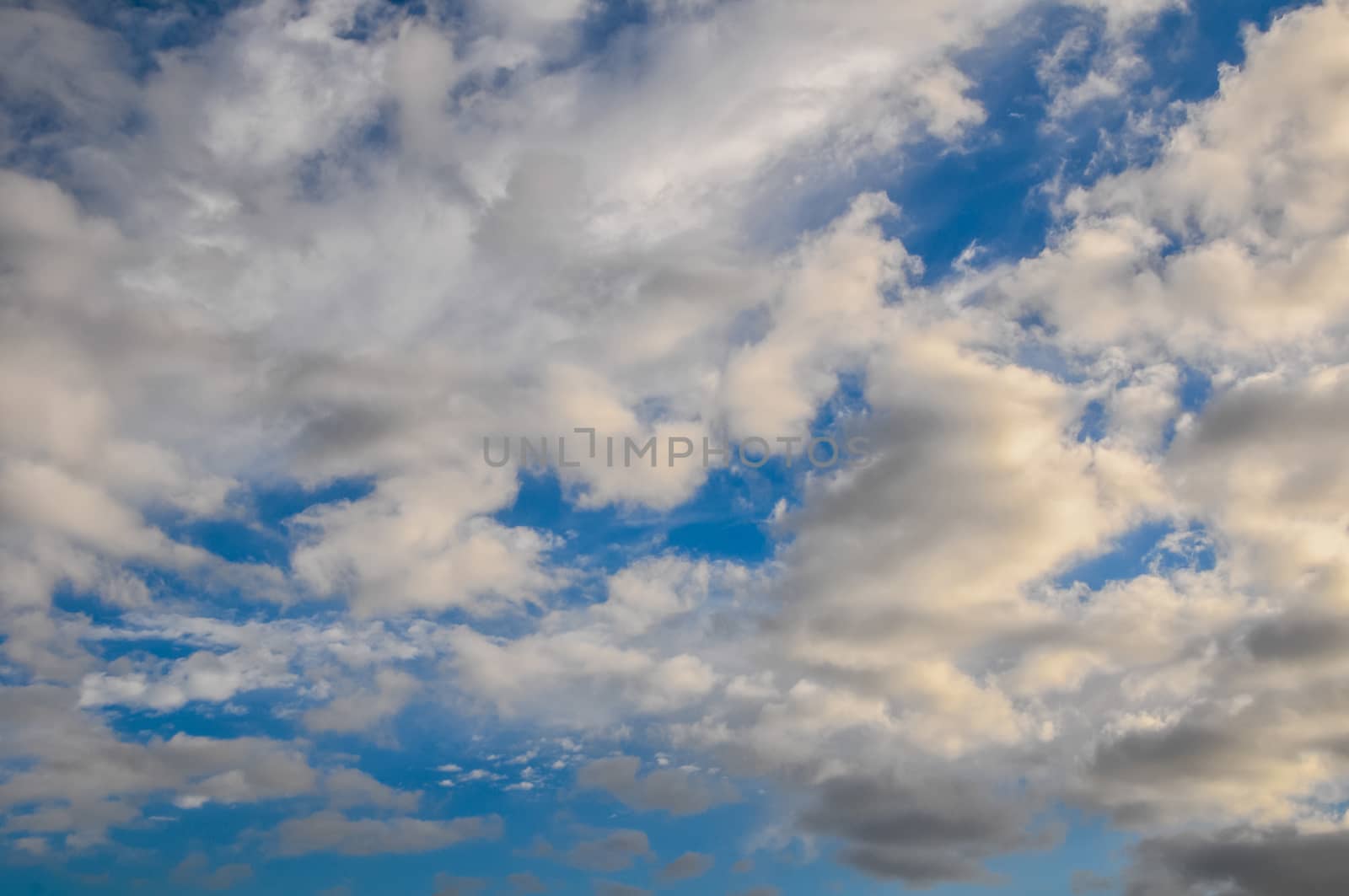 Cloudscape, Colored Clouds at Sunset near the Ocean