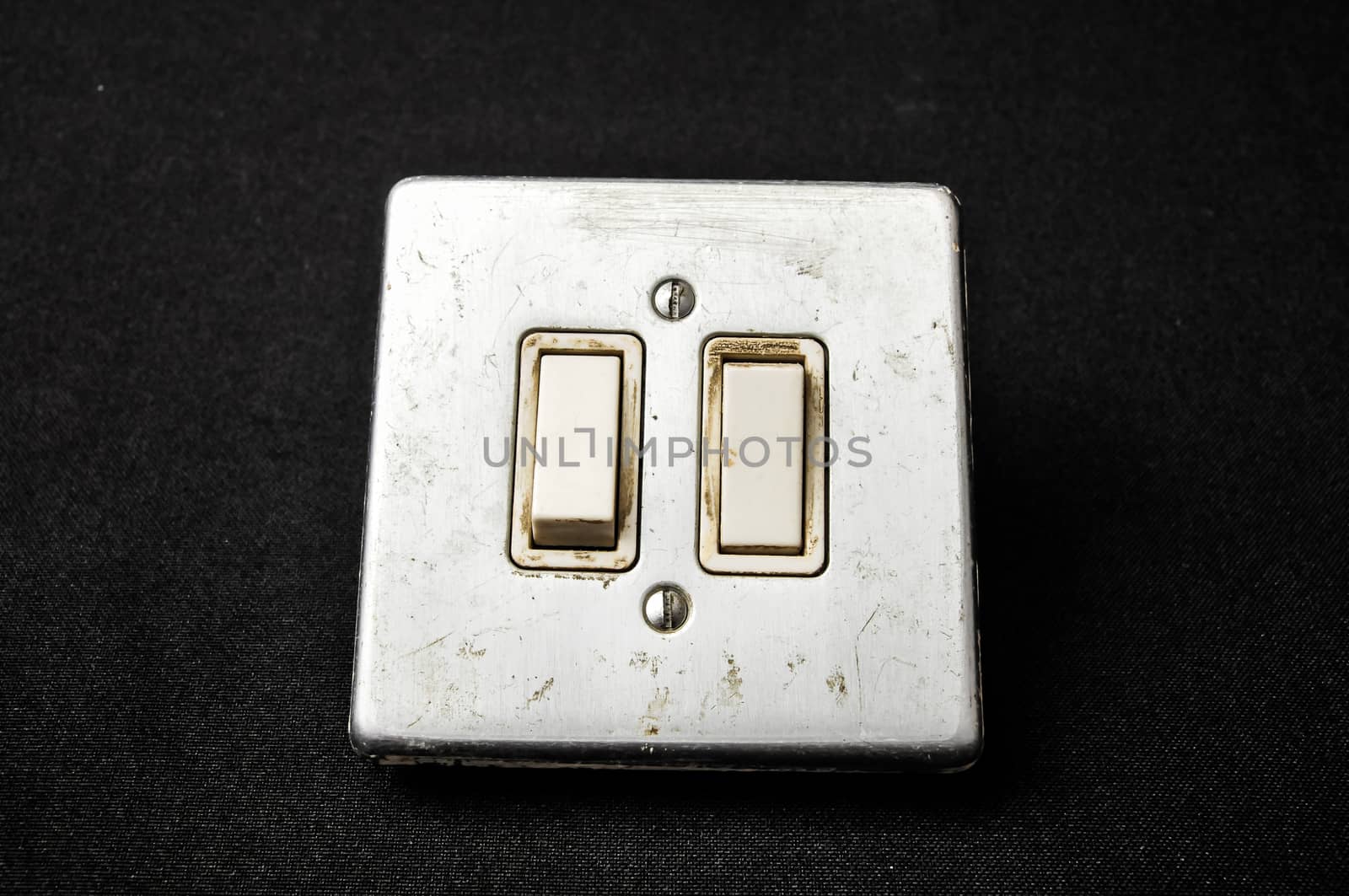 Light switch, old-style on a Black Background