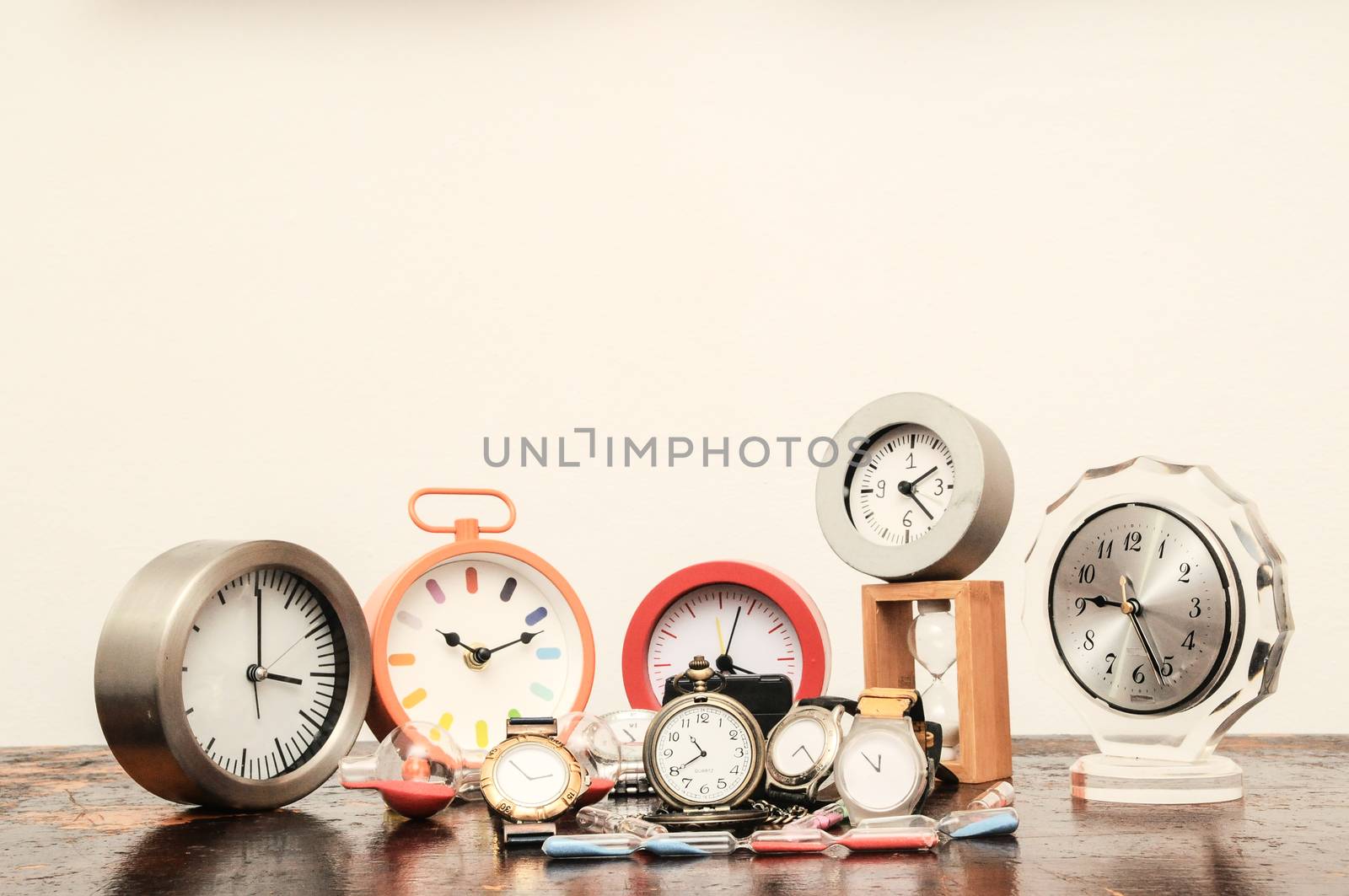 Many Different Clocks on a Woden Table