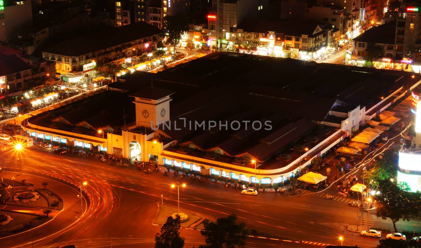 HO CHI MINH CITY, VIET NAM- MAR 23: Ben Thanh market at night, famous destination of Vietnam travel in Ho chi Minh, line of light on street, nightscape of colorful city, VietNam, Mar 23, 2014