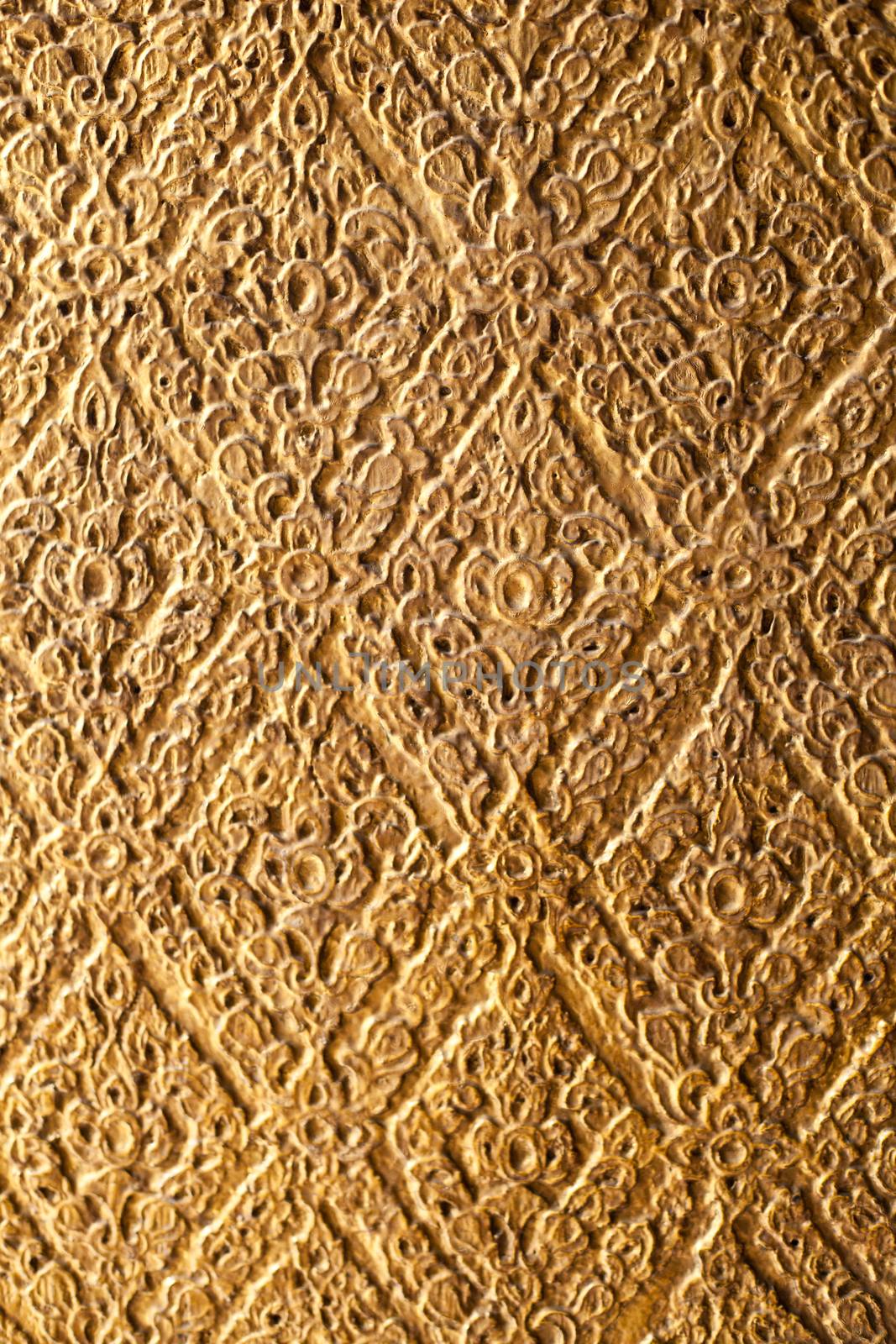 The background pattern is carved with the Thai national identity.