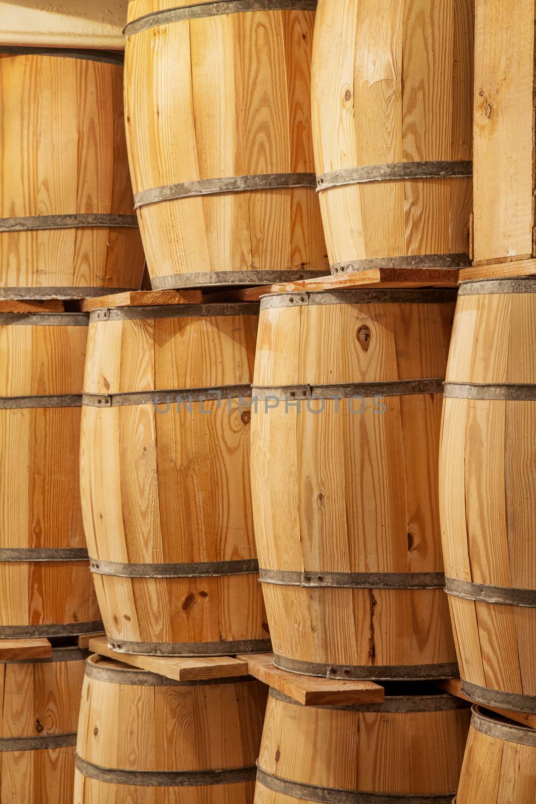 new wooden barrels background - a storage concept